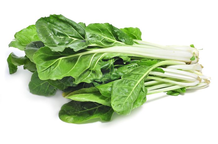 13272581 – chard leaves on a white background